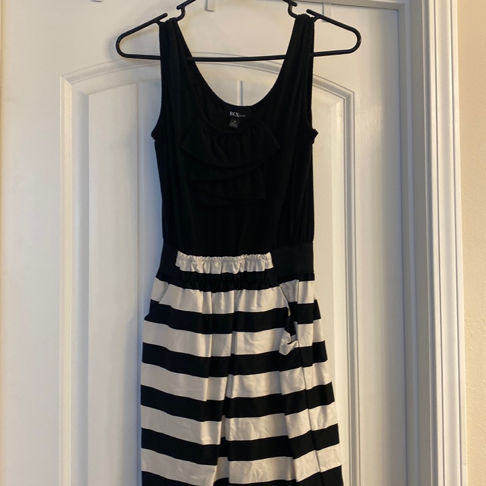 Black top with black and cream striped bottom dress.